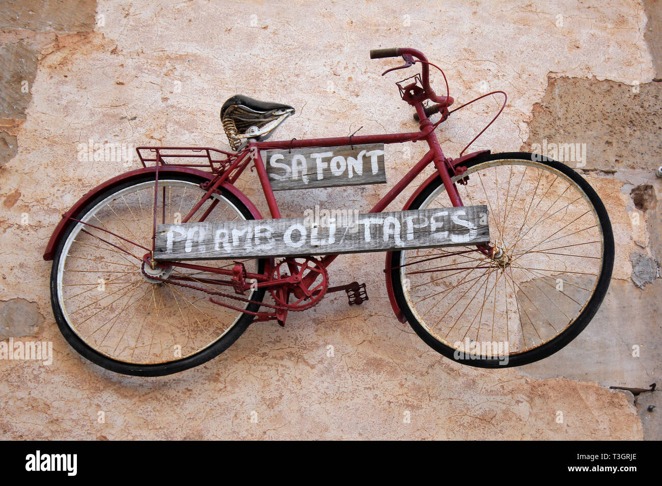 Bicycle On Wall, Santanyi, Mallorca Stock Photo