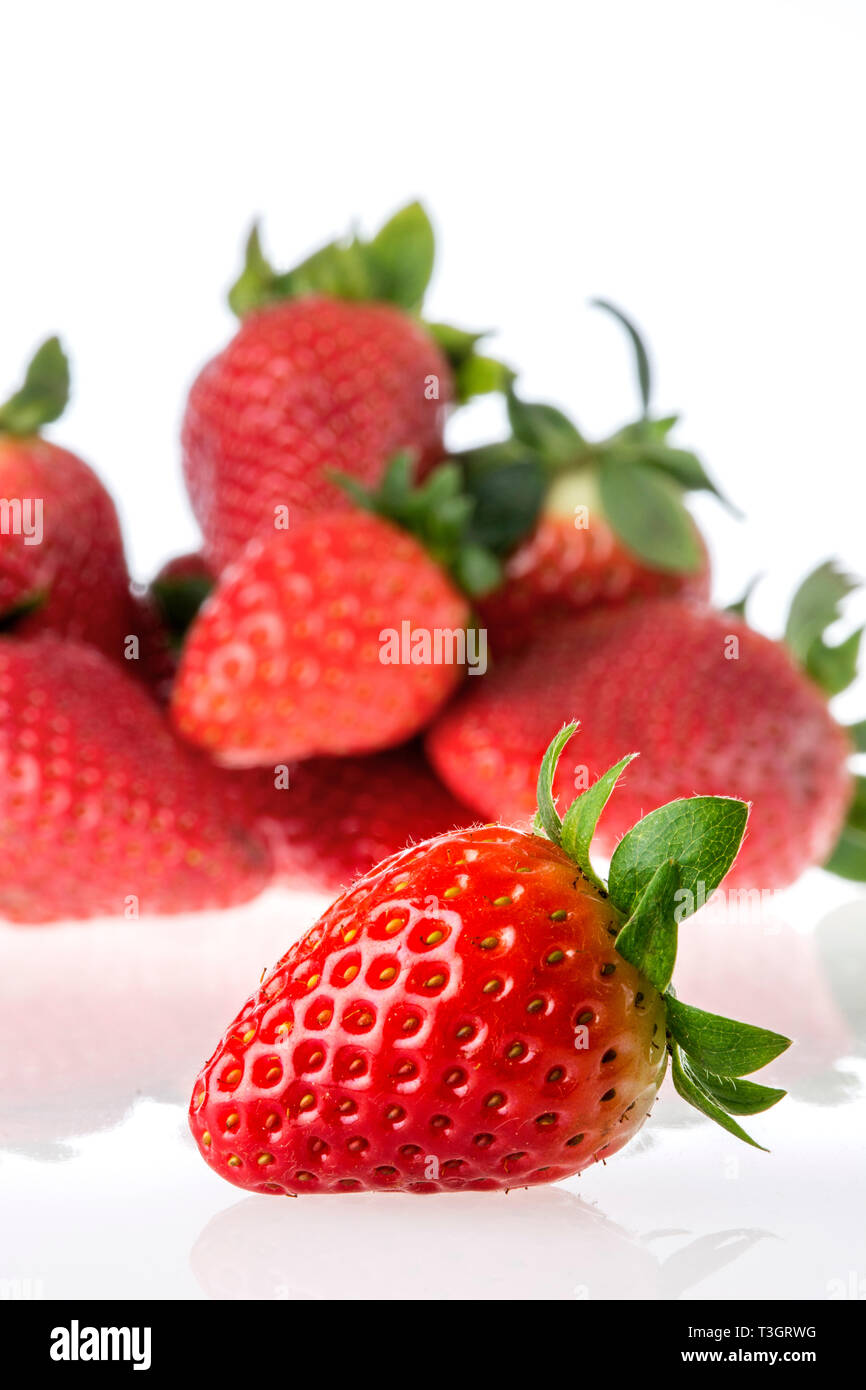 Group of people eating strawberries hi-res stock photography and images ...