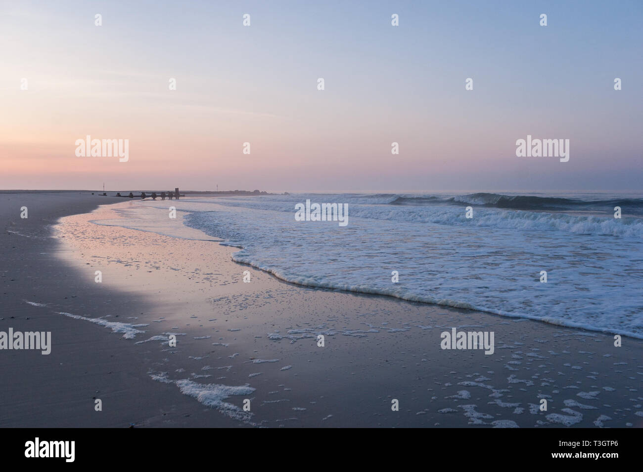 The beach in Cape May, New Jersey and a dramatic sunrise Stock Photo