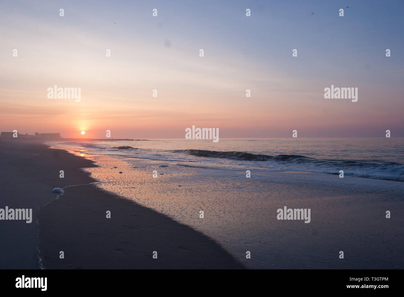 The beach in Cape May, New Jersey and a dramatic sunrise Stock Photo