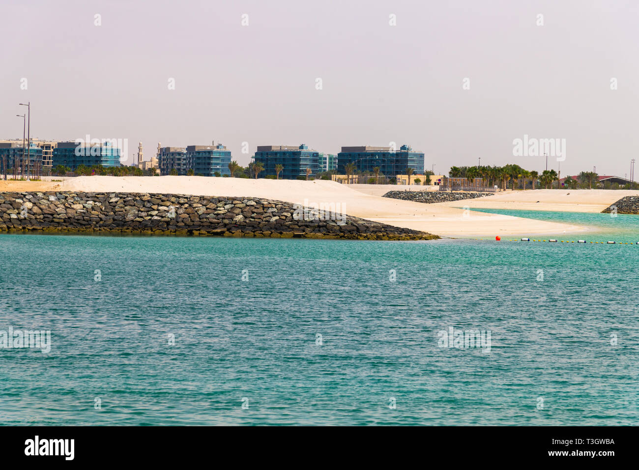 empty white sand beaches in Abu Dhabi, UAE View of city from the sea
