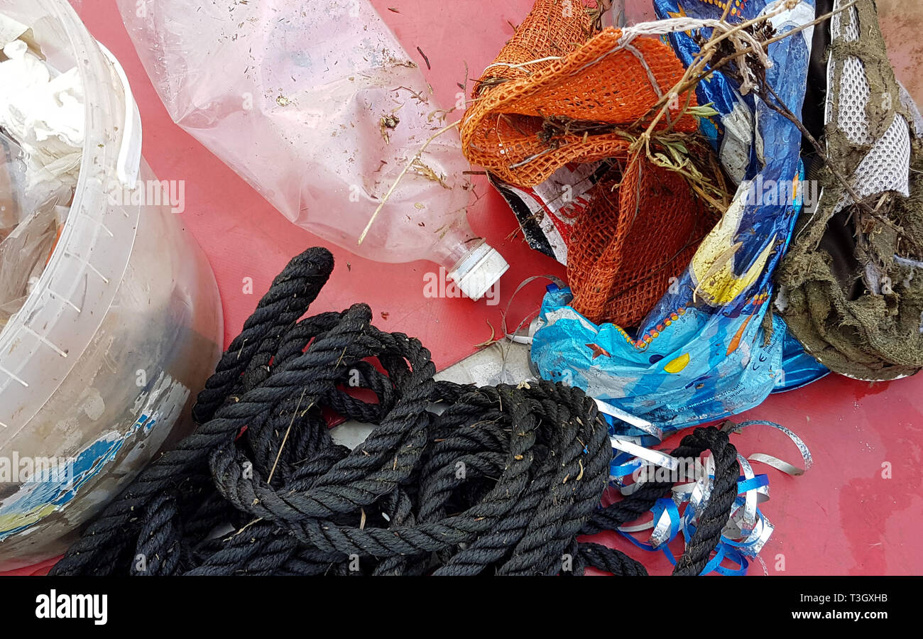 Plastics including bottles, balloons, rope and food packaging which have been collected by local boat captain Derek Dewson from the water around Blakeney Point on the Norfolk coast, which is home to thousands of seals every year during the pupping season. Stock Photo