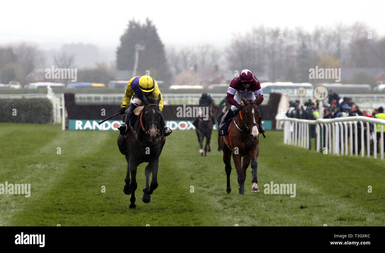 Kalashnikov ridden by Jack Quinlan (left) wins the Devenish Manifesto Novices Chase during Grand National Thursday of the 2019 Randox Health Grand National Festival at Aintree Racecourse. Stock Photo