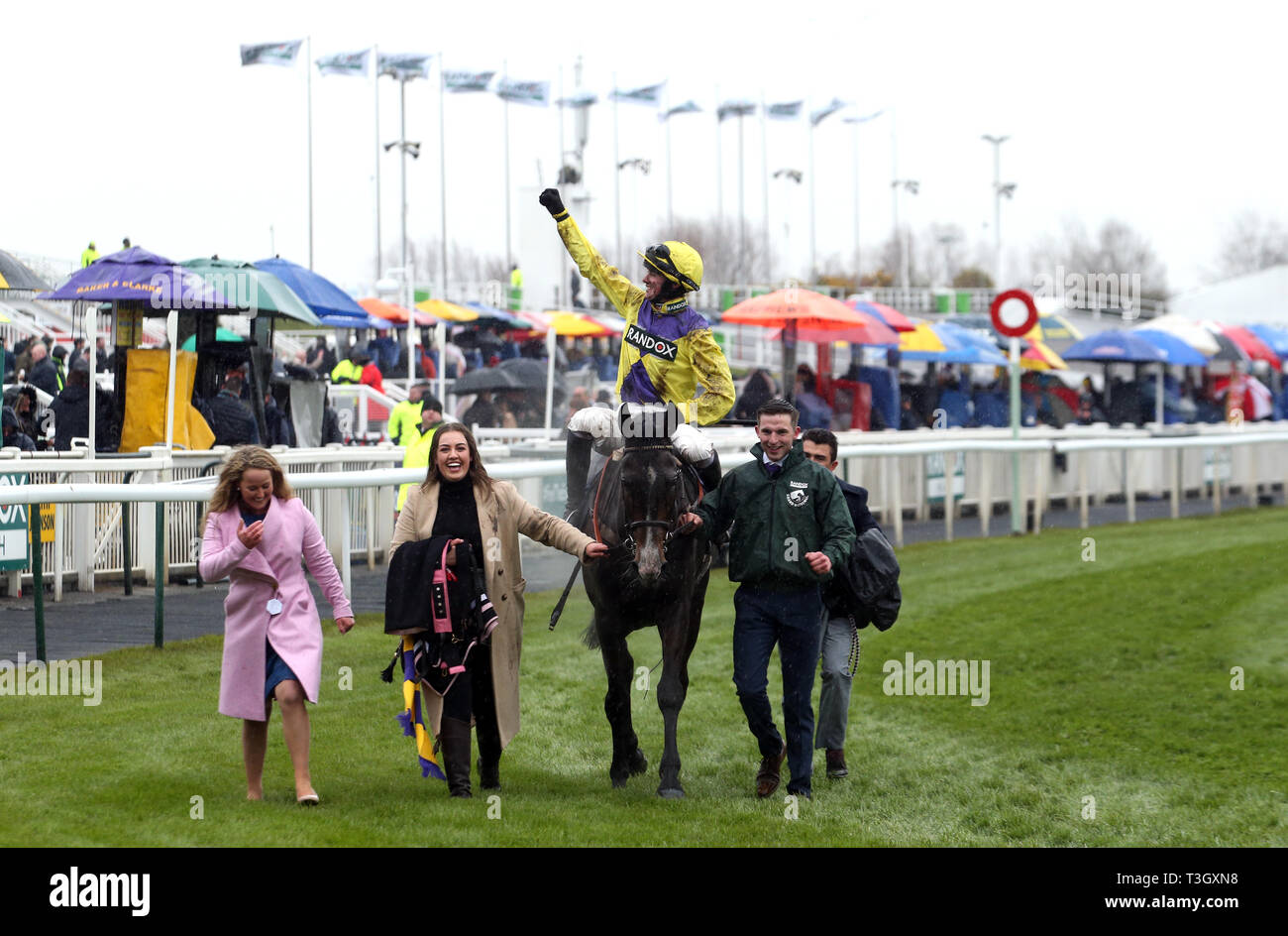 Kalashnikov ridden by Jack Quinlan with connections after winning the Devenish Manifesto Novices Chase during Grand National Thursday of the 2019 Randox Health Grand National Festival at Aintree Racecourse. Stock Photo