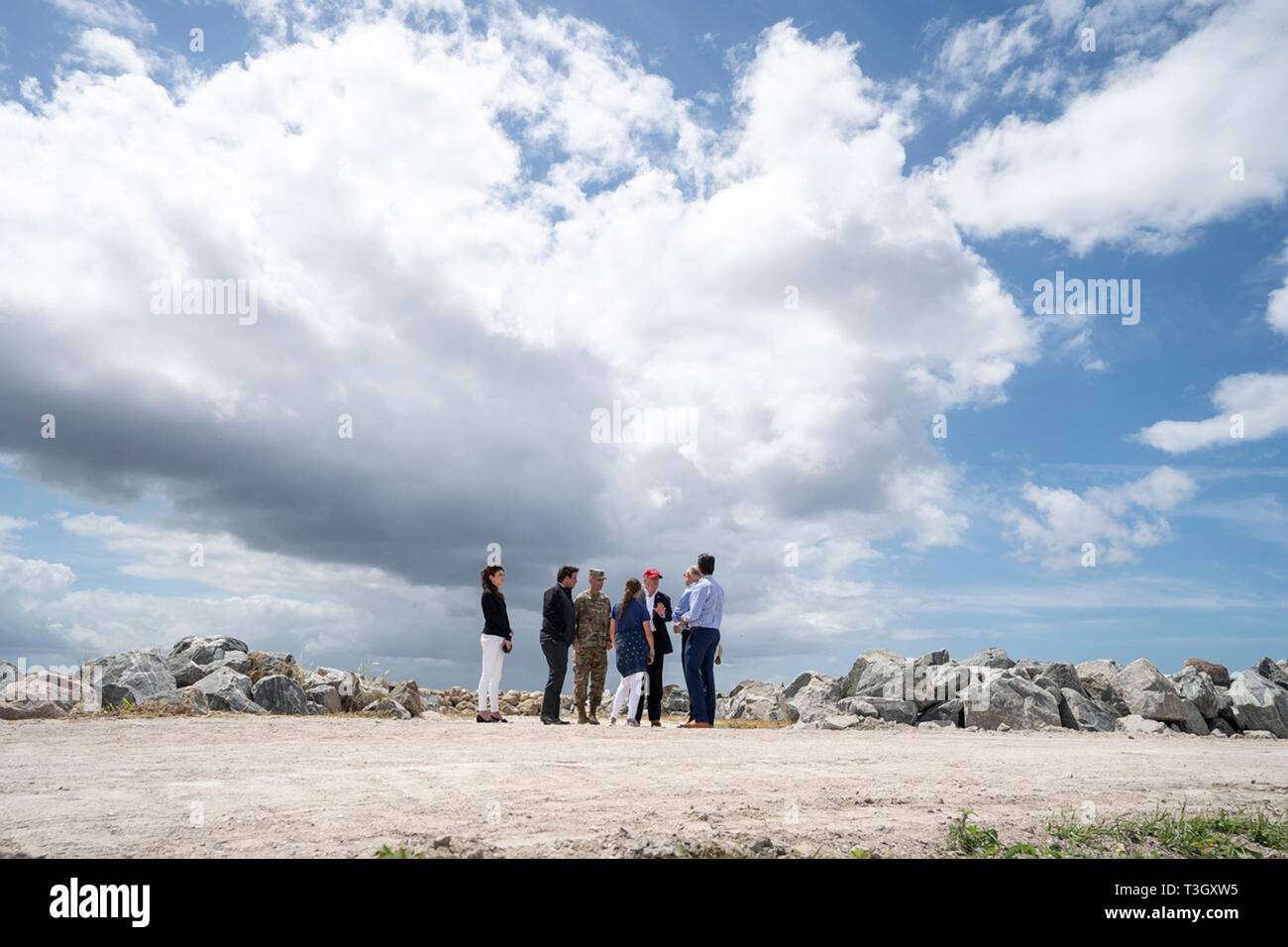 U.S President Donald Trump tours the Herbert Hoover Dike during a visit to Lake Okeechobee with Florida Gov. Ron DeSantis, Sen. Marco Rubio, and Sen. Rick Scott March 29, 2019 in Canal Point, Florida. The Herbert Hoover Dike is a 143-mile earthen dam that surrounds Lake Okeechobee and currently under a massive renovation and repair project. Stock Photo