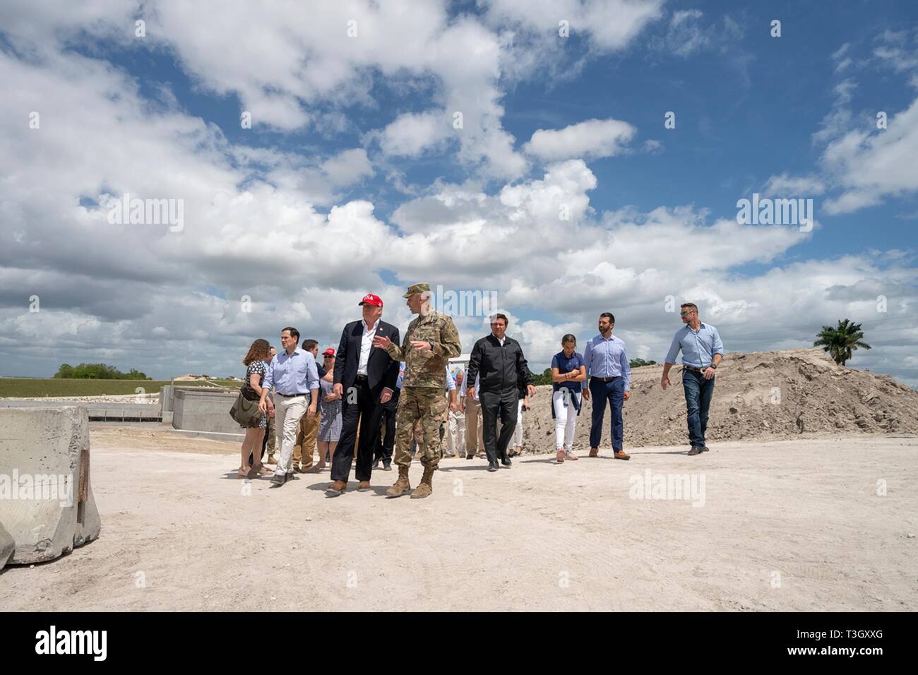 U.S President Donald Trump tours the Herbert Hoover Dike during a visit to Lake Okeechobee with Florida Gov. Ron DeSantis, Sen. Marco Rubio, and Sen. Rick Scott March 29, 2019 in Canal Point, Florida. The Herbert Hoover Dike is a 143-mile earthen dam that surrounds Lake Okeechobee and currently under a massive renovation and repair project. Stock Photo