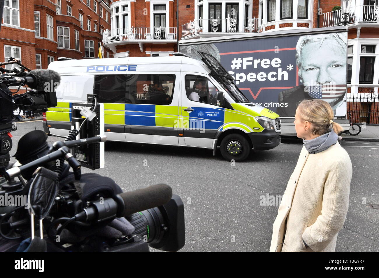 An Australian tv crew view a police van outside the Ecuadorian Embassy in London, following reports that the Wikileaks founder Julian Assange is to be evicted. Stock Photo