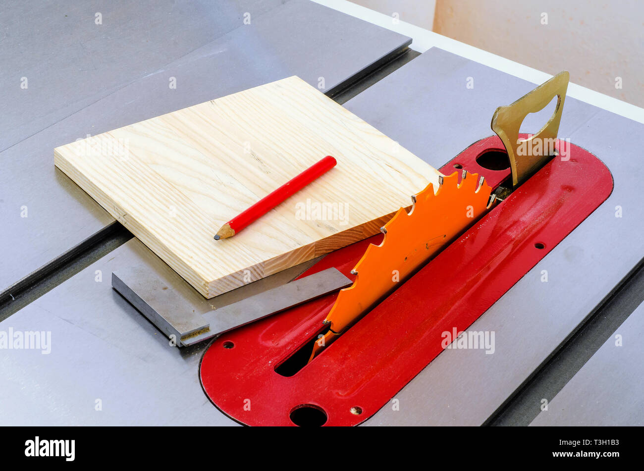 square plate, tools, lying on a machine circular saw in a workshop ...