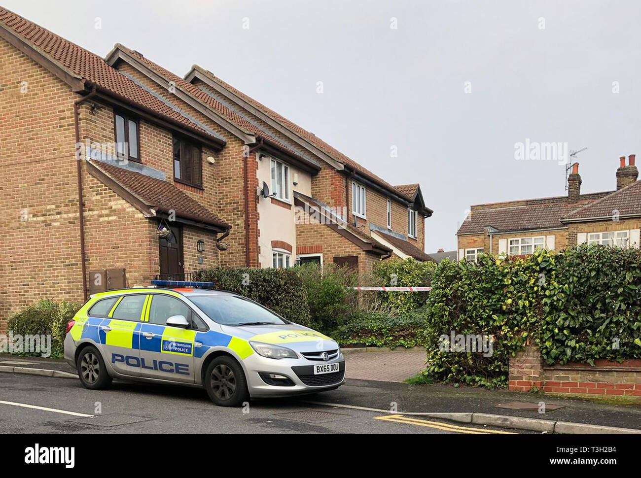 Police outside an address in Westminster Gardens, Chingford where two 19-year-old men were found with stab wounds. Stock Photo