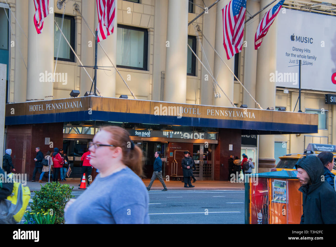 New York, NY - April 3, 2019: Front entrance and marquee of The Hotel Pennsylvania in Manhattan, New York City with the doorman in front and pedestria Stock Photo