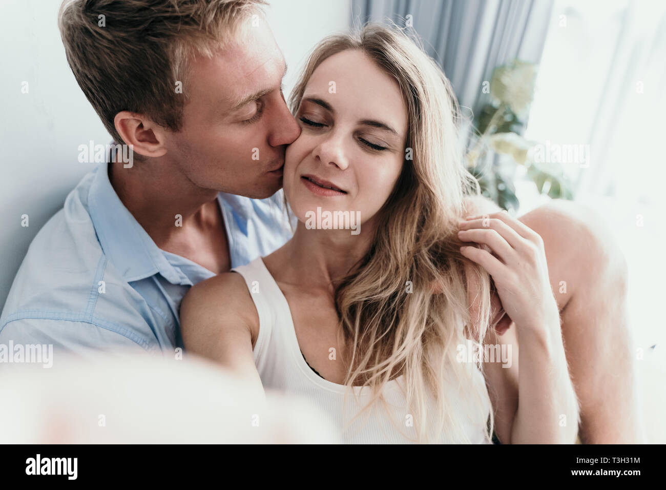 young lovely couple kissing when take selfie together Stock Photo