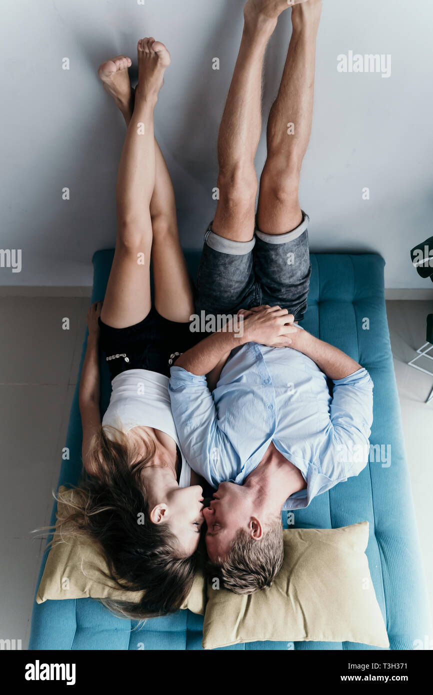 couple bonding and smiling while lying Stock Photo