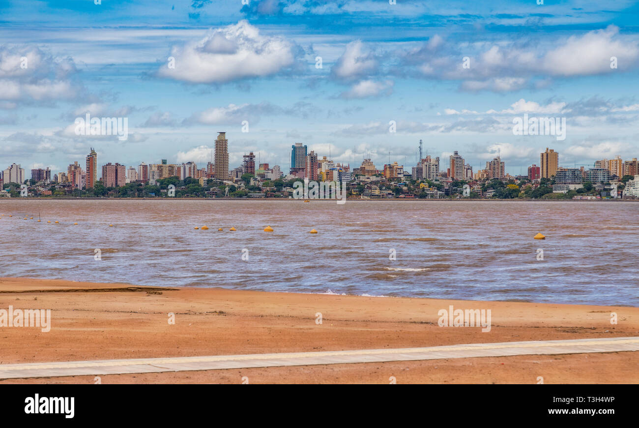Skyline of Posadas in Argentina, photographed from the beach in Encarnacion / Paraguay. Stock Photo