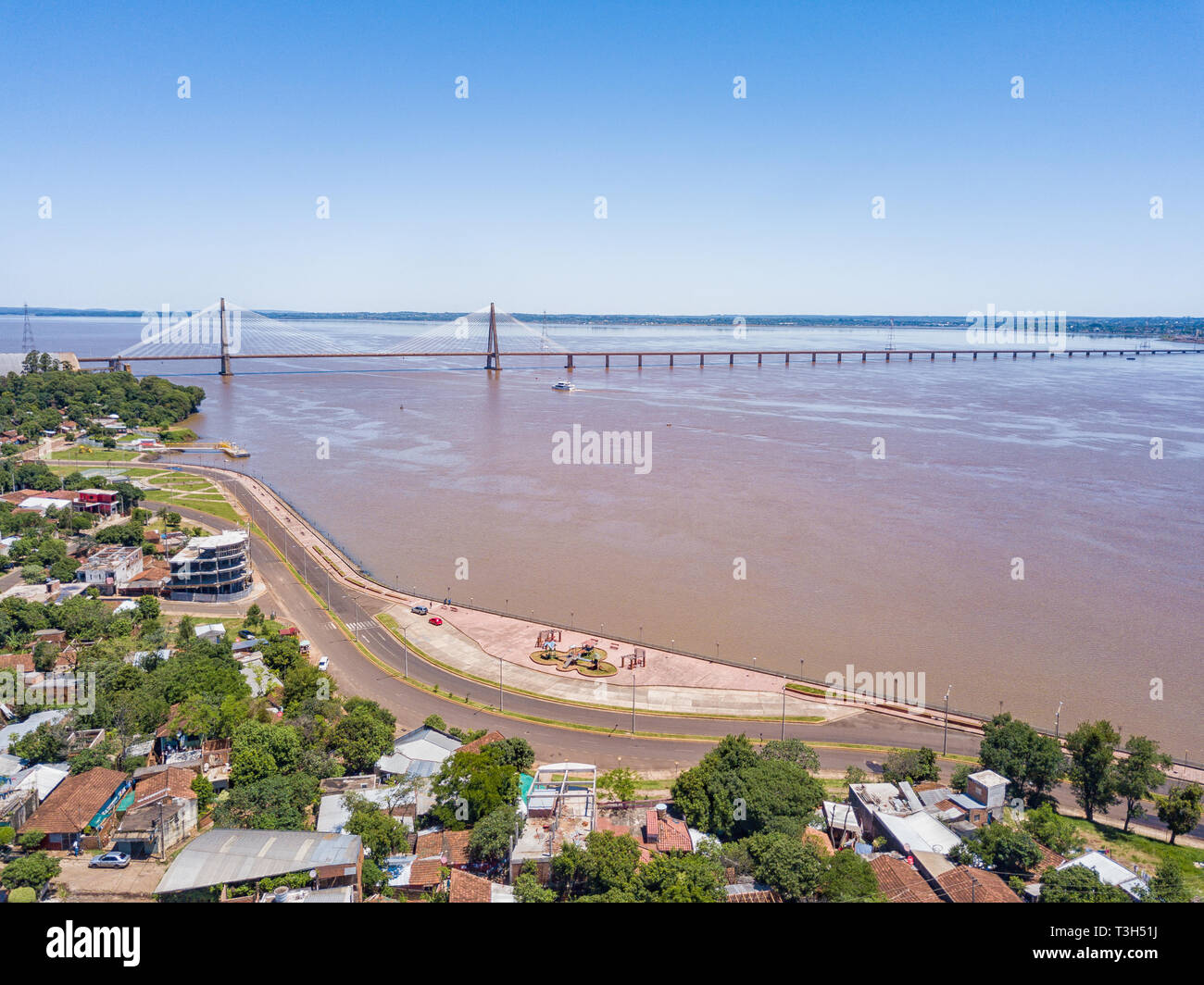 Aerial view of Encarnacion in Paraguay overlooking the bridge to Posadas in Argentina. Stock Photo