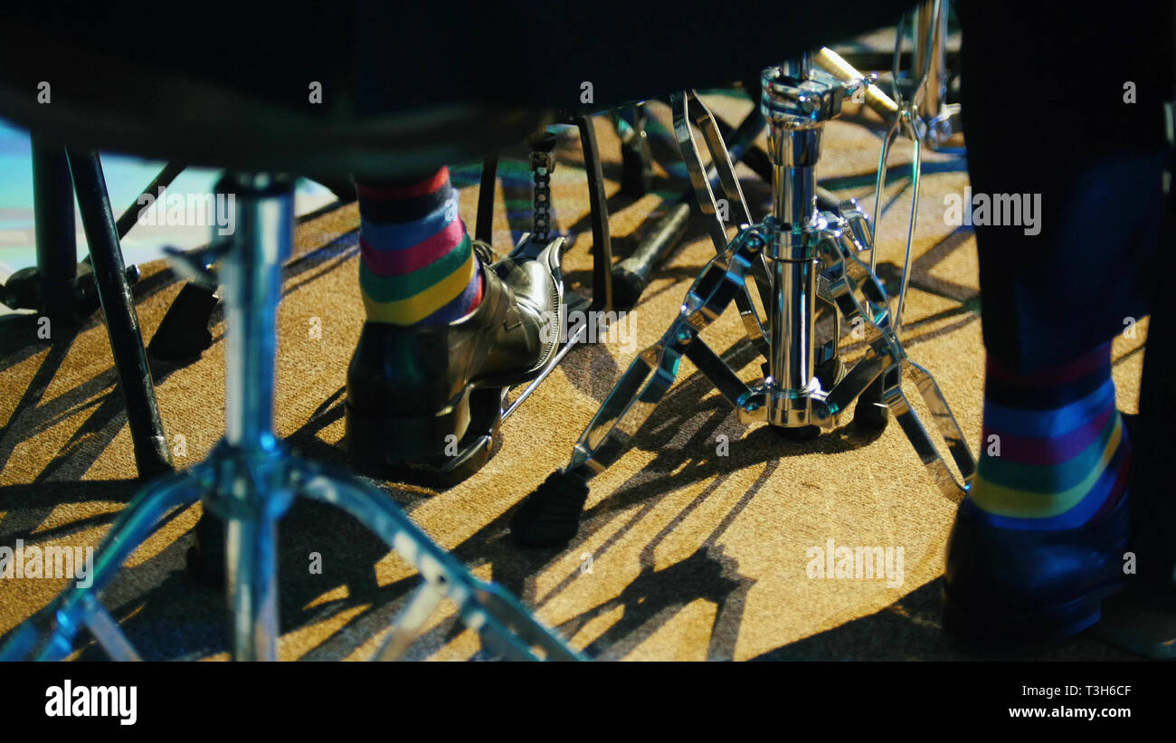 A person playing drums. Hitting the kick Stock Photo Alamy