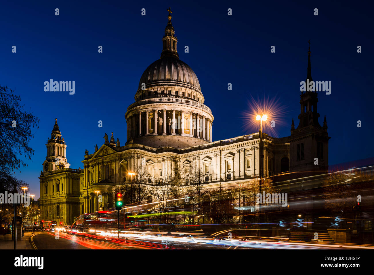 Traffic in front of St Paul's Cathedral after dusk, London, UK Stock Photo