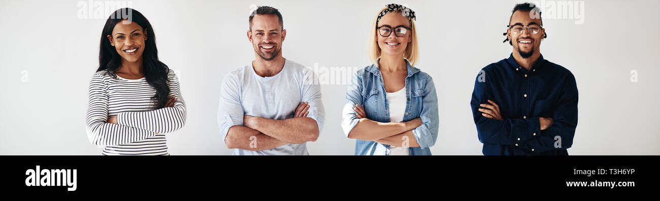 Smiling group of diverse young entrepreneurs standing in a row with ...