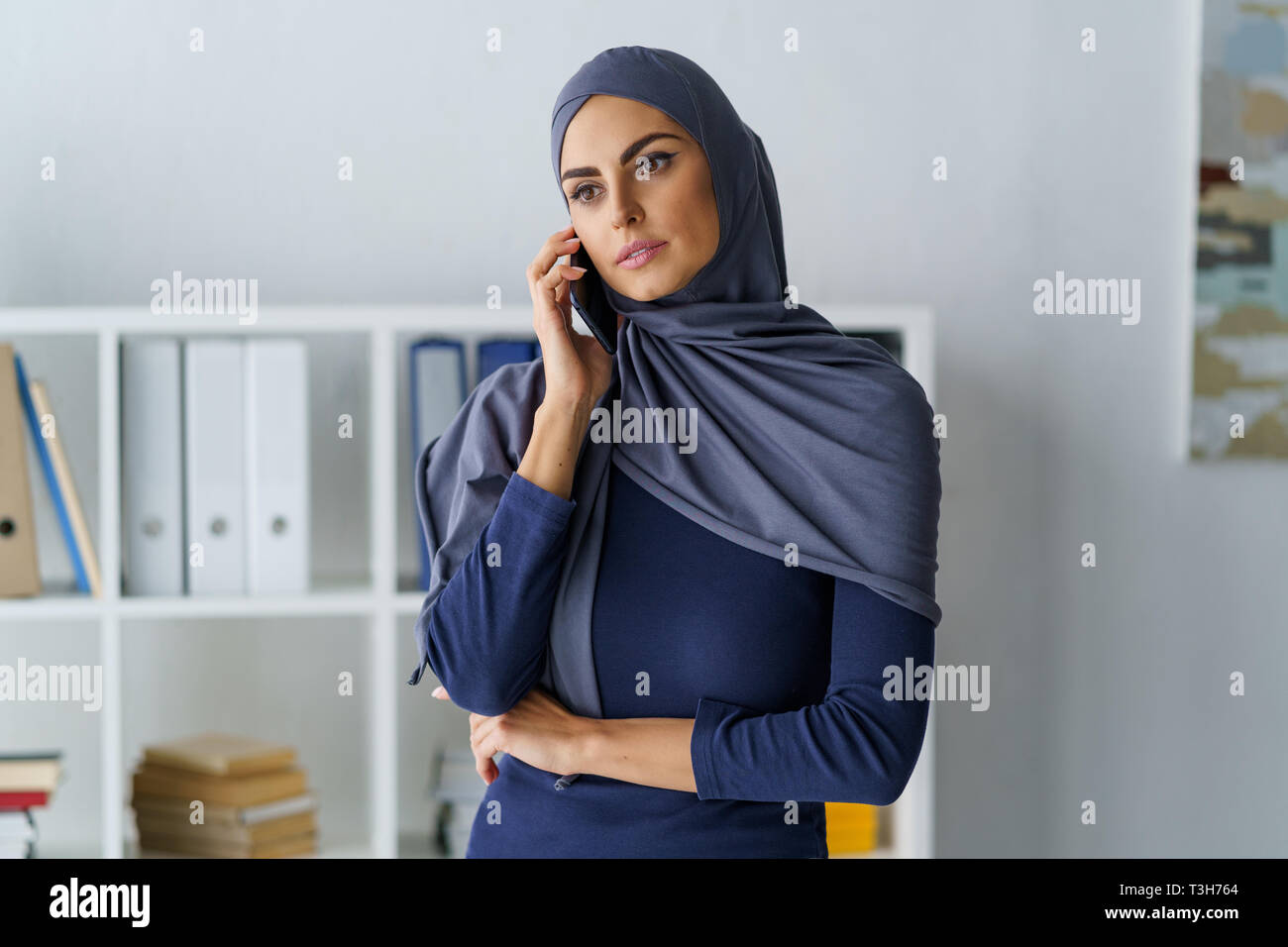 Female manager talking on phone Stock Photo