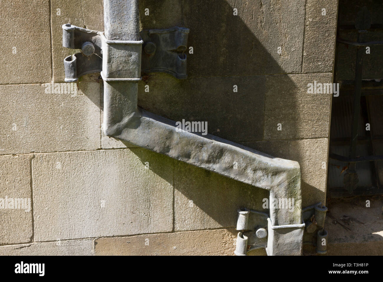 Ancient lead drainpipe on Corpus Christi College, Oxford Stock Photo