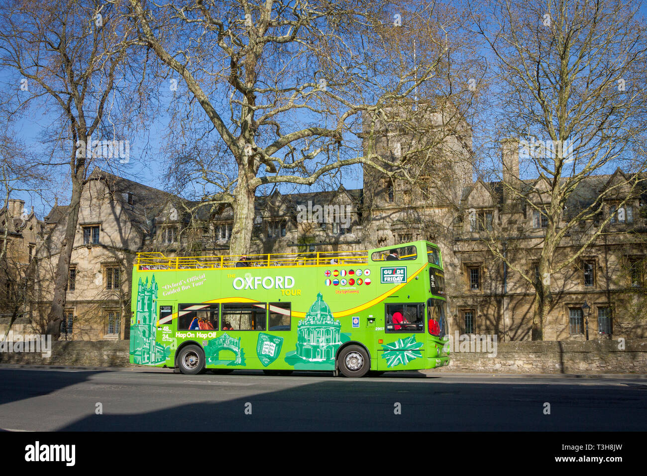 An Oxford Tour open-top bus in St. Giles, Oxford with St. John's College behind Stock Photo