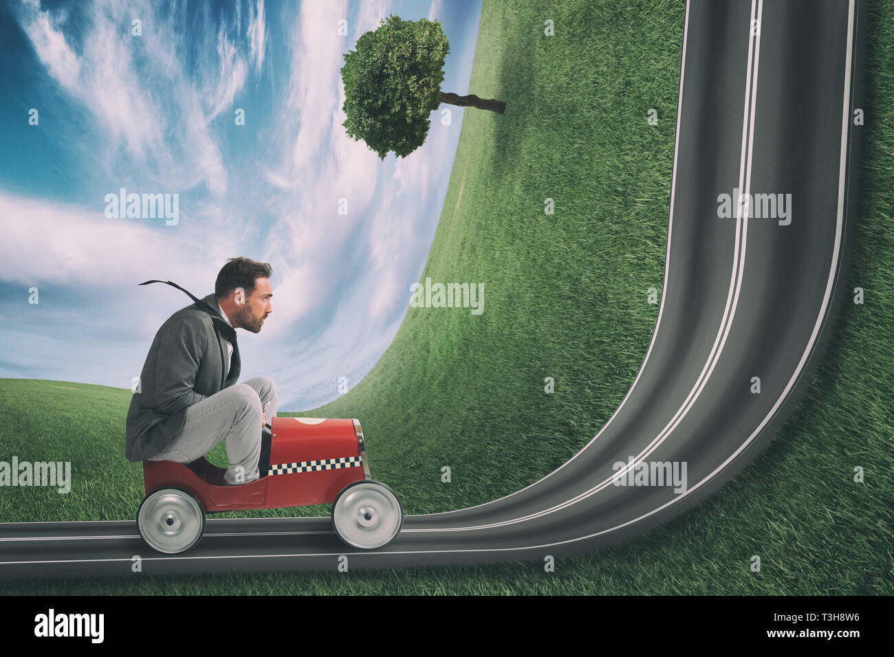 Businessman climb an uphill road with a small car. Difficult carrer concept Stock Photo