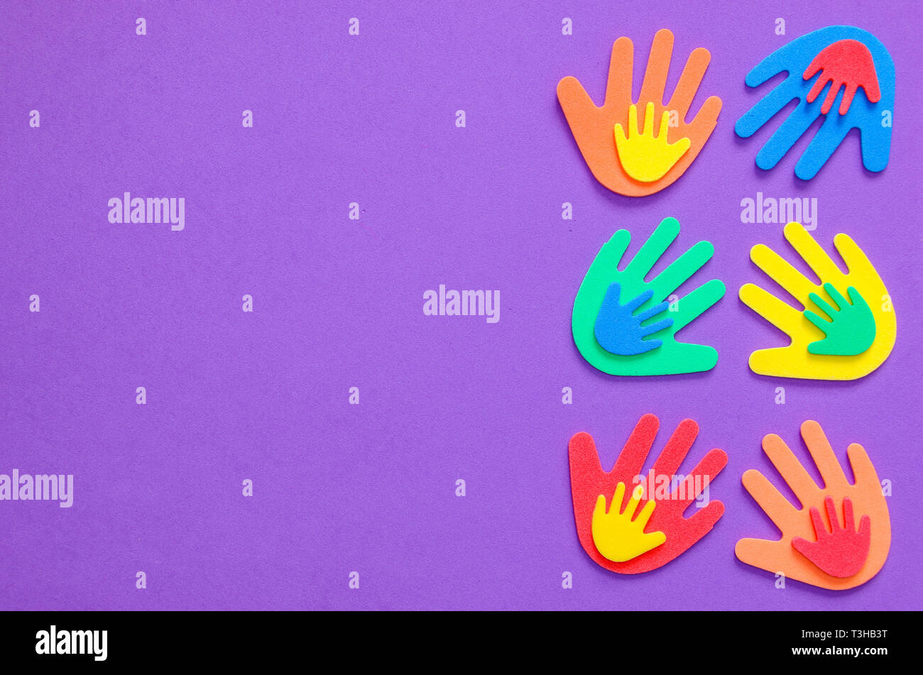 Brightly colored foam hand shapes of green, orange, red, yellow and