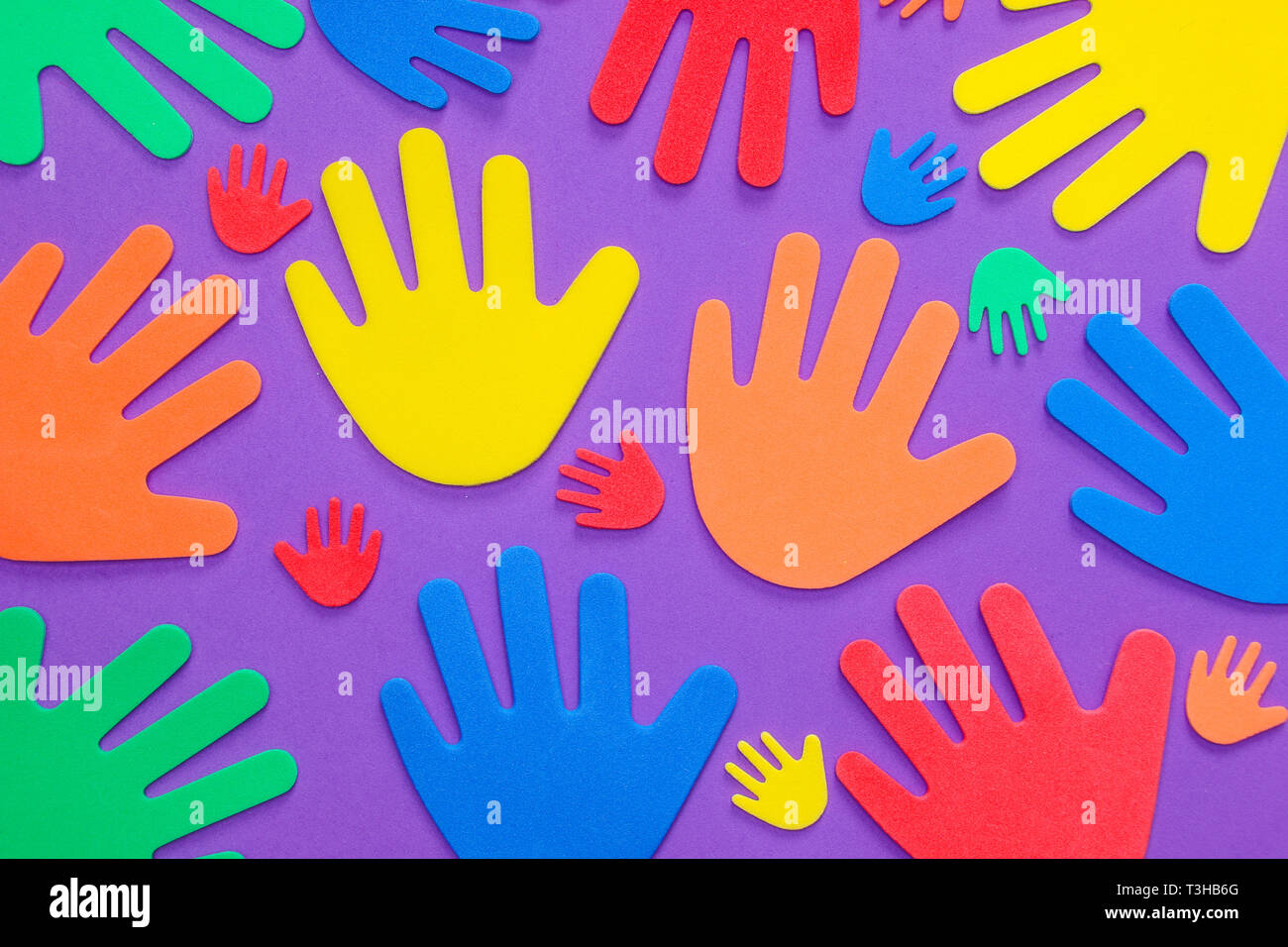 Brightly colored foam hand shapes of green, orange, red, yellow and