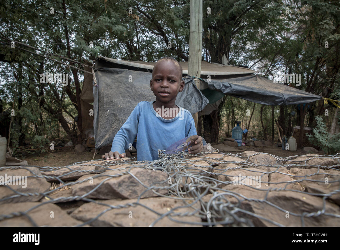 A child seen in Kakuma refugee camp, northwest Kenya. Kakuma is home to members of the local Turkana community and the nearby refugee camps shelter roughly 190,000 refugees from countries including Ethiopia, Burundi, Somalia, Tanzania and Uganda. Stock Photo