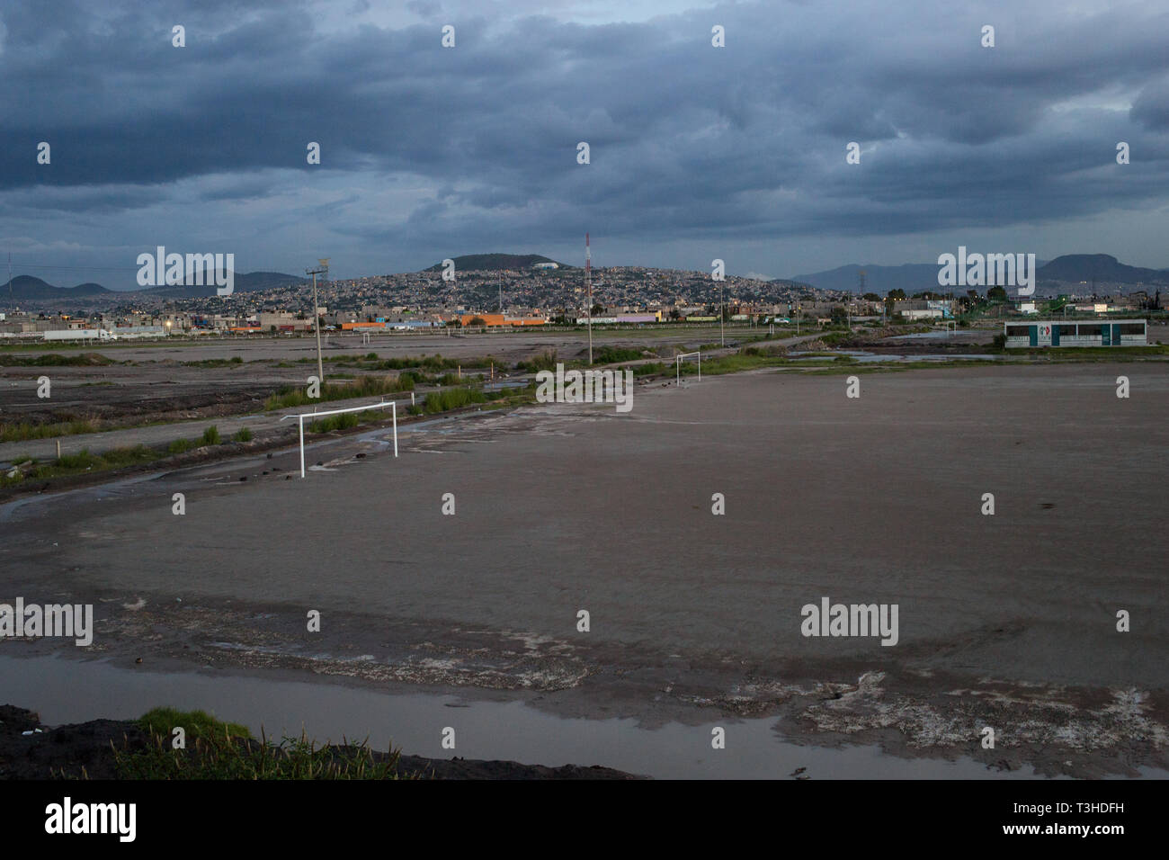 An area of land that was once part of Lake Texcoco, in Chimalhuac‡n, the State of Mexico, Mexico, August 24, 2017. A group of local residents are engaged in a land dispute over this land, which they call ÒTlatelesÓ, or Òmountain of sandÓ which the Mexican Federal Government wanted to use for the new Mexico City Airport International project. Mexico's newly elected president Andreas Lopez Manuel Obrador canceled this project in the fall of 2018, while it was in the middle of construction. The airport was set to replace the aging Benito Juarez International Airport. Stock Photo