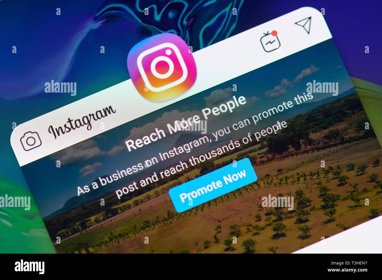 New york, USA - april 8, 2019: Promote post in instagram  on digital screen macro close up view Stock Photo