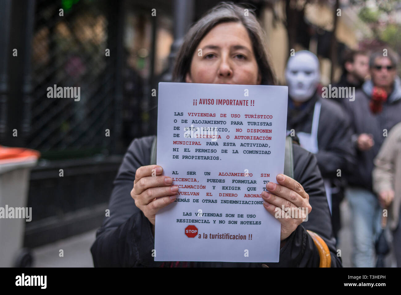 A woman seen with a placard during the demonstration. The neighbours of the district of Letras and Lavapies protested against the tourist flats of their neighbourhoods and to stop its uncontrolled proliferation in some neighbourhoods and municipalities of the region. Stock Photo