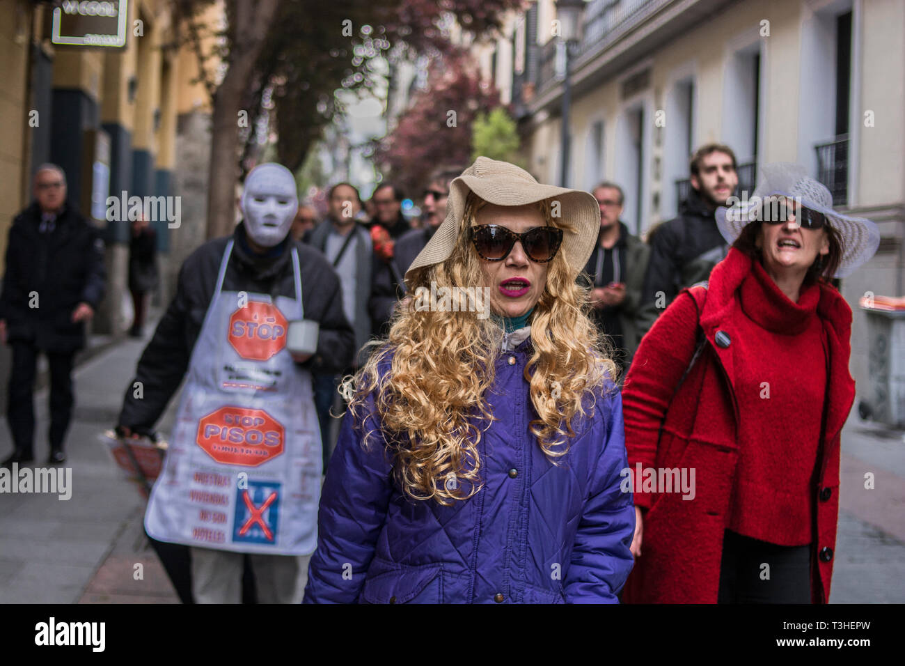 A woman with a wig seen screaming, out tourist of the centre, during the demonstration. The neighbours of the district of Letras and Lavapies protested against the tourist flats of their neighbourhoods and to stop its uncontrolled proliferation in some neighbourhoods and municipalities of the region. Stock Photo