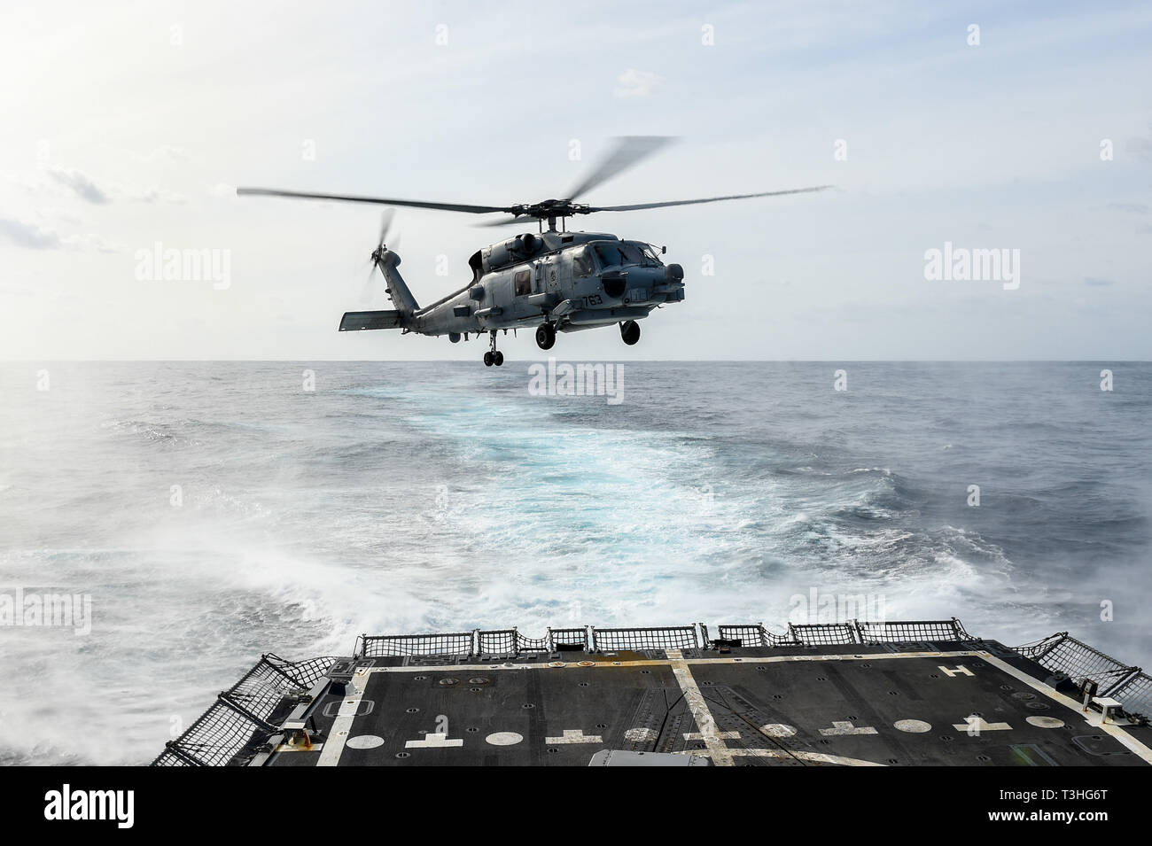190404-N-UM706-0185 ATLANTIC OCEAN (April 4, 2019) An MH-60R Sea Hawk Helicopter assigned to the “Grandmasters” of Helicopter Maritime Strike Squadron (HSM) 46 takes off of the flight deck aboard the Arleigh Burke-class guided-missile destroyer USS Nitze (DDG 94). Nitze is underway as part of Abraham Lincoln Carrier Strike Group (ABECSG) deployment in support of maritime security cooperation efforts in the U.S. 5th, 6th and 7th Fleet areas of responsibility. With Abraham Lincoln as the flagship, deployed strike group assets include staffs, ships and aircraft of Carrier Strike Group 12 (CSG 12) Stock Photo