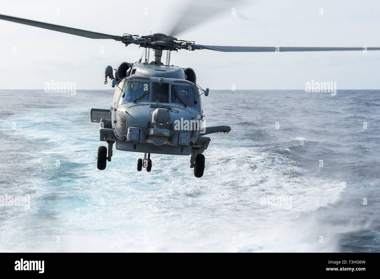 190404-N-UM706-0147 ATLANTIC OCEAN (April 4, 2019) An MH-60R Sea Hawk Helicopter assigned to the “Grandmasters” of Helicopter Maritime Strike Squadron (HSM) 46 takes off of the flight deck aboard the Arleigh Burke-class guided-missile destroyer USS Nitze (DDG 94). Nitze is underway as part of Abraham Lincoln Carrier Strike Group (ABECSG) deployment in support of maritime security cooperation efforts in the U.S. 5th, 6th and 7th Fleet areas of responsibility. With Abraham Lincoln as the flagship, deployed strike group assets include staffs, ships and aircraft of Carrier Strike Group 12 (CSG 12) Stock Photo