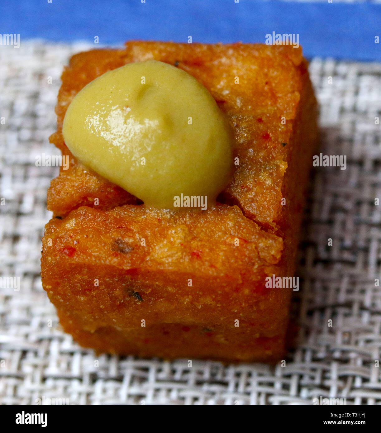 Chickpea appetizers with a mustard drop on crystal glass dish hires
