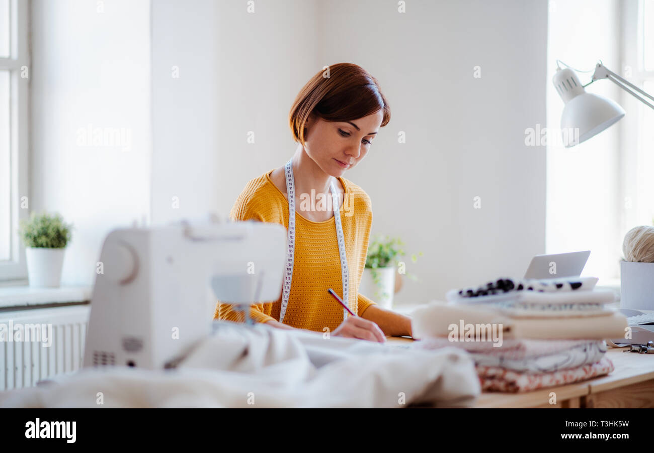 Young creative woman in a studio, startup of small tailoring business Stock Photo Alamy