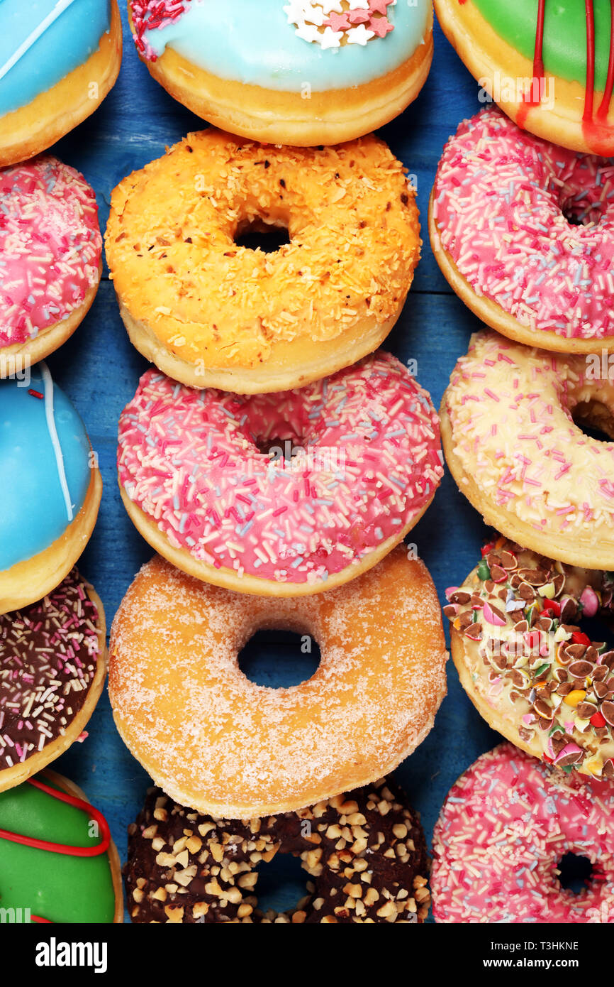 assorted donuts with chocolate frosted, pink glazed and sprinkles ...