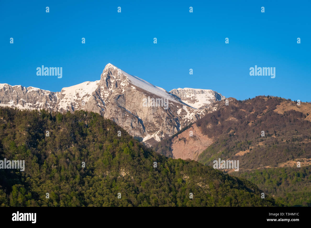View from village Kobarid in Soca valley to summit of mountain Krn in Julian Alps in Slovenia Stock Photo