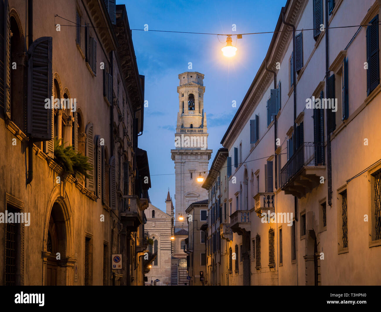 The white bell tower of the Cathedral of Verona in Italy at sunset. Stock Photo