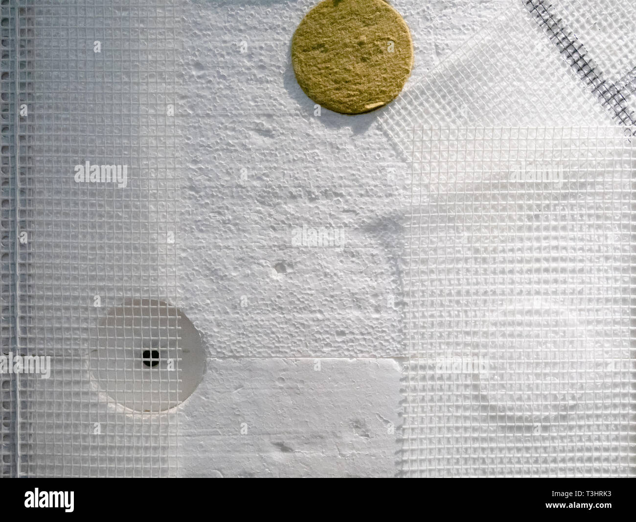 foam plastic board styrofoam with armored grid on a building wall for