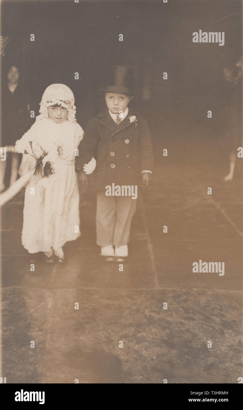 Vintage Photographic Postcard Showing a Child Bride and Groom Stock Photo