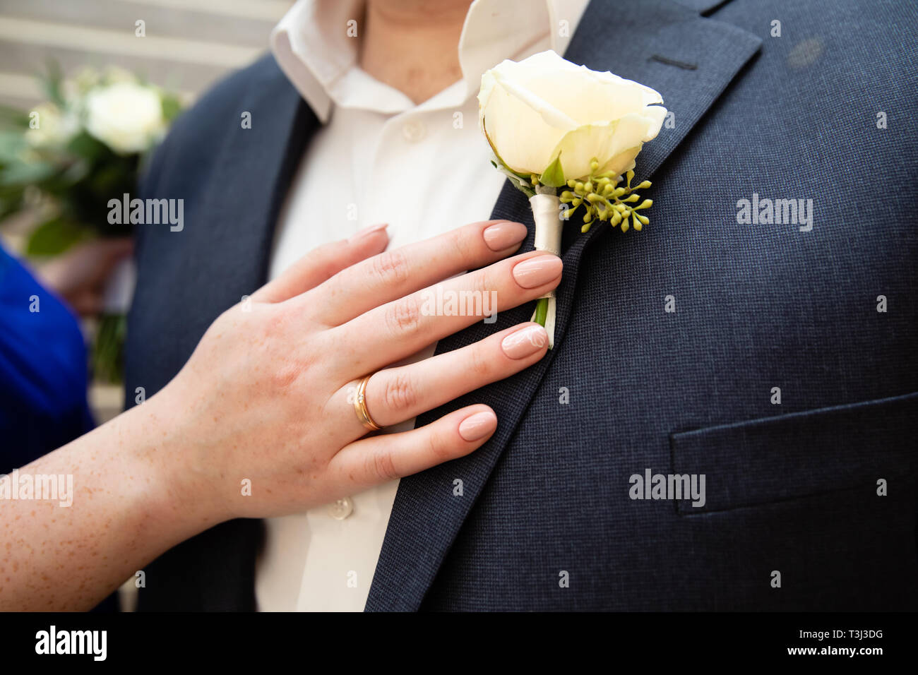 Groom suite with floral decoration Stock Photo