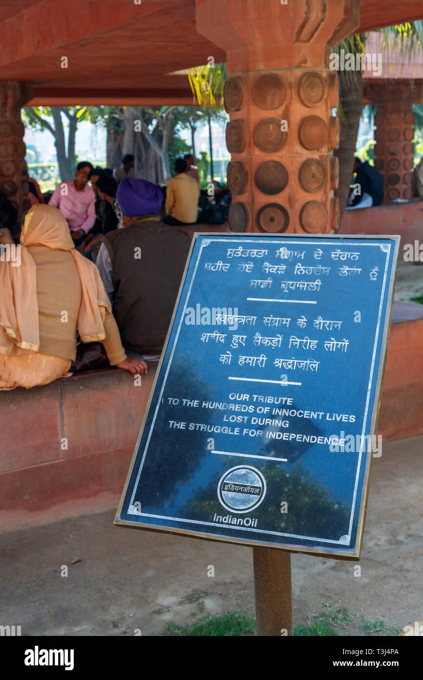 Tribute plaque in Jallianwala Bagh, a public garden in Amritsar, Punjab, India, commemorating the Jallianwala Bagh Massacre shooting by British occupying forces Stock Photo