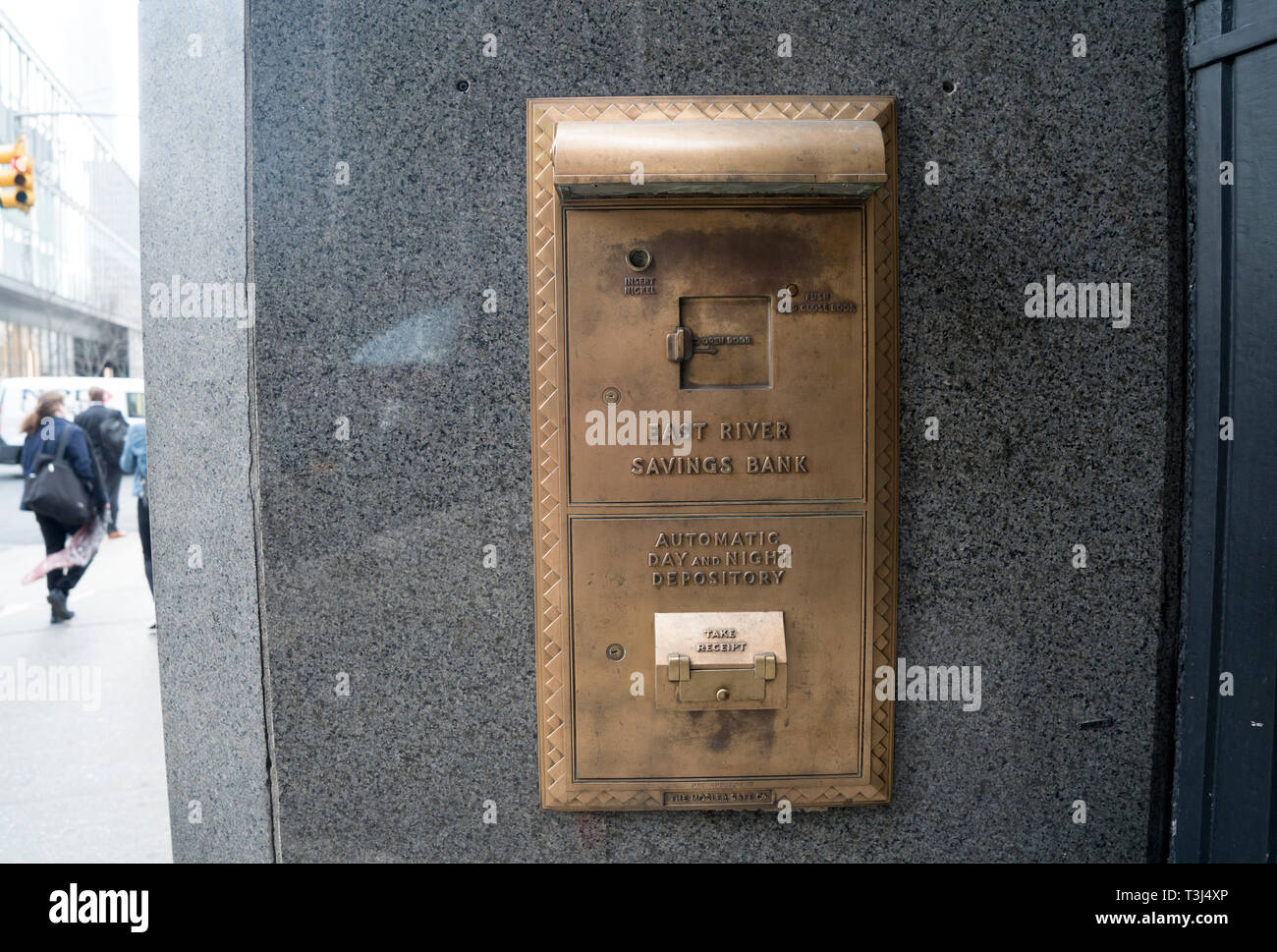 The Art Deco building that once housed the East River Savings Bank in Lower Manhattan was turned into a store but the bank's night depository remains. Stock Photo