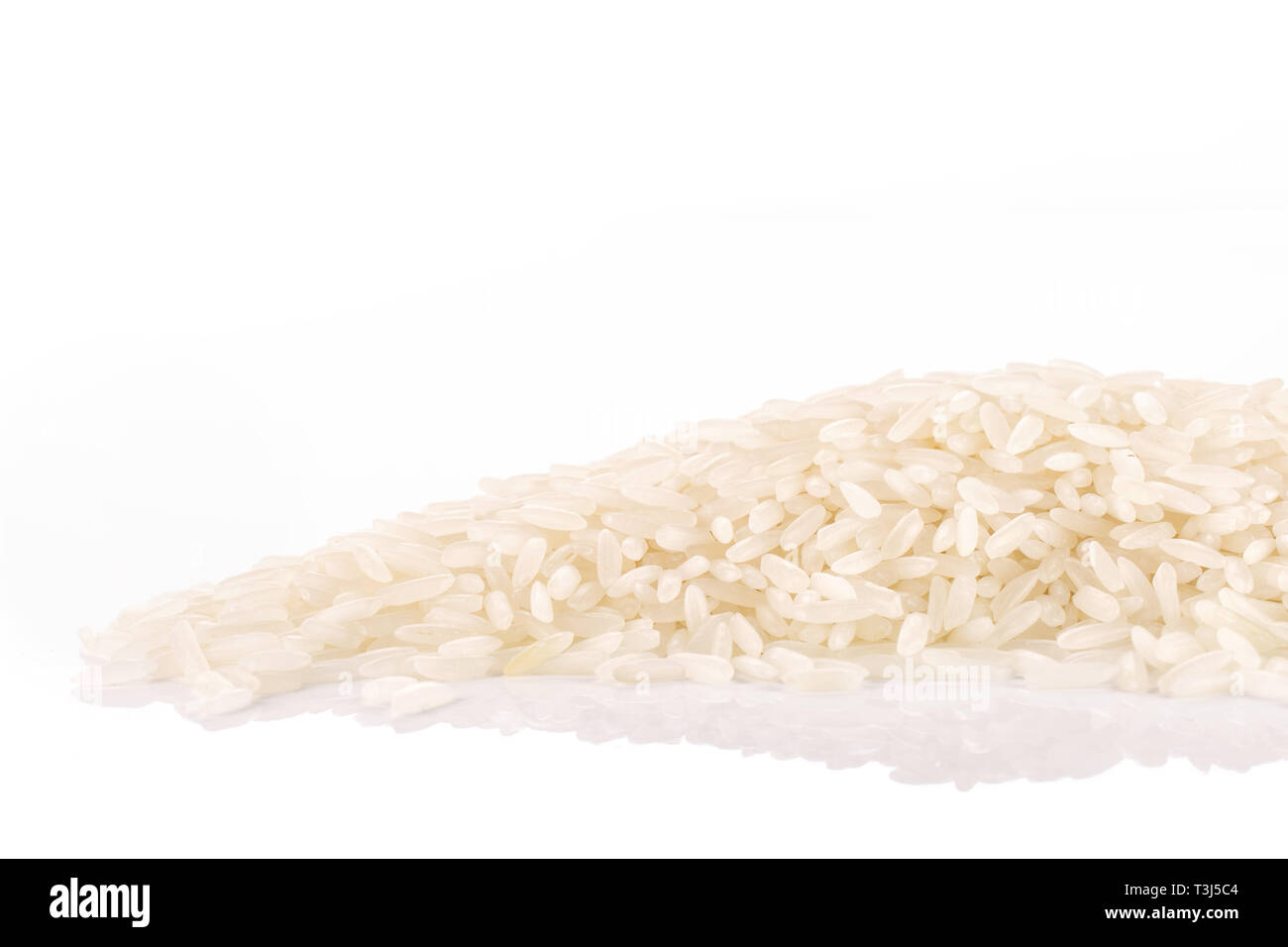 Lot of whole white jasmine rice grains isolated on white background