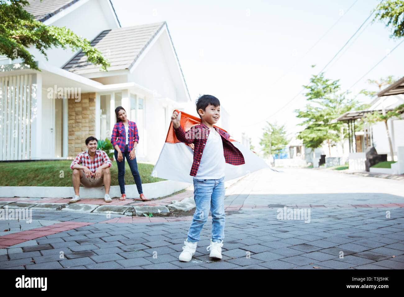 kid holding flag celebrating independence day Stock Photo