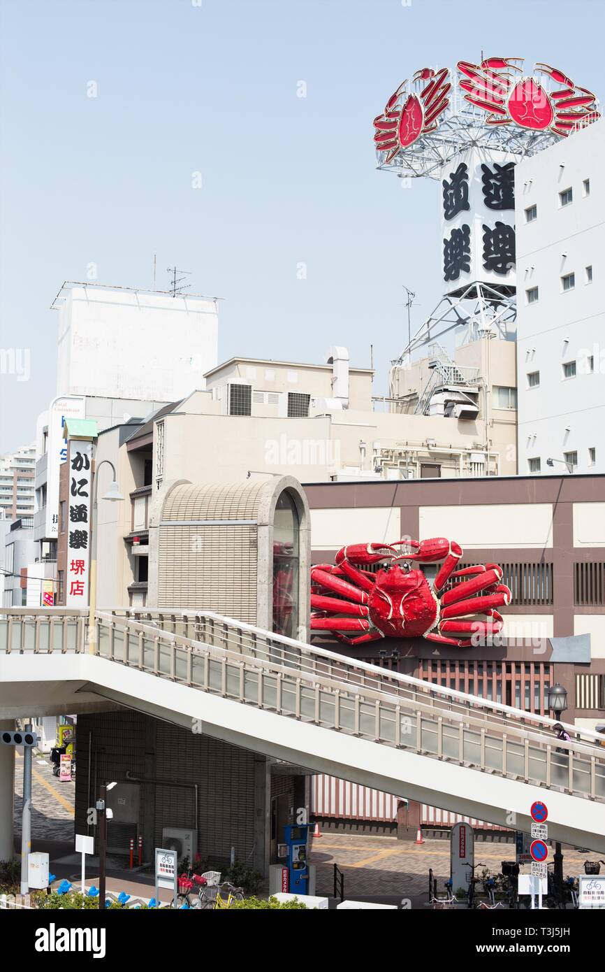 Street view, including a restaurant with giant crab signs, in Sakai City, Osaka, Japan. Stock Photo