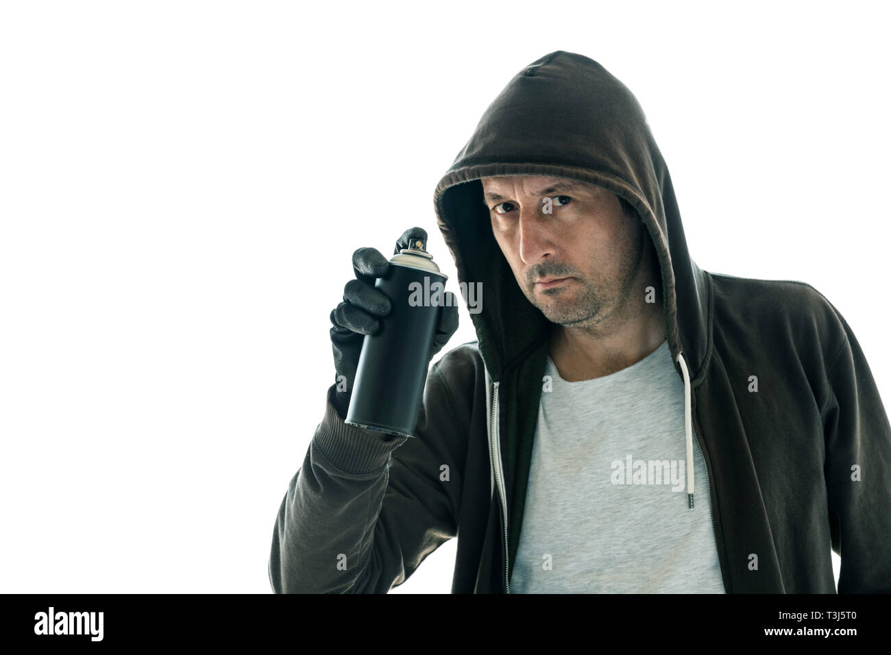 Hooded graffiti artist with spray paint can isolated on white background Stock Photo