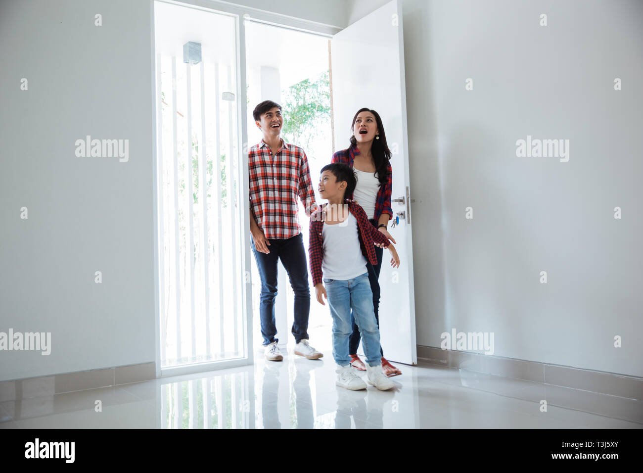 Family Asian Entering Their New Home Stock Photo Alamy