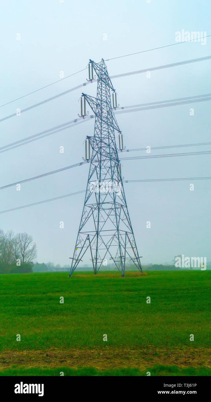 Electric Lines and Pylons on third going into the distance Stock Photo